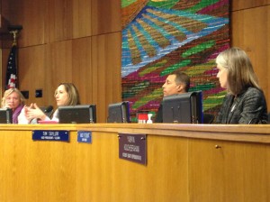 Board Member Gina Daleiden (left) lays out board procedure as Sheila Allen (far left), Tim Taylor (right) and Nancy Peterson (far right) look on.