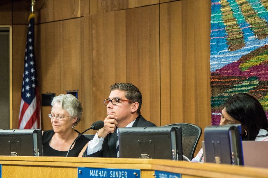 Board President Alan Fernandes listens to public comment on Thursday evening