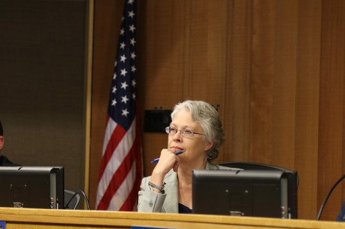 Susan Lovenburg listens to public comment on Thursday.