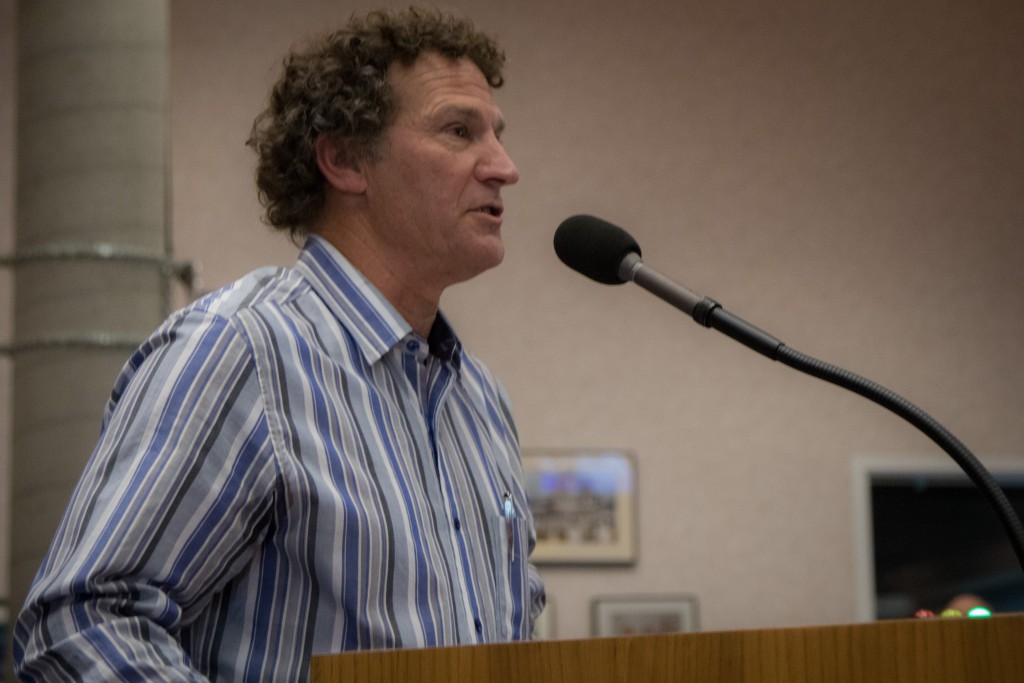 Former Councilmember Stephen Souza reads a letter from himself and eight other former Mayors and City Councilmembers