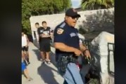 A Cop Yells at Kids and Draws His Gun